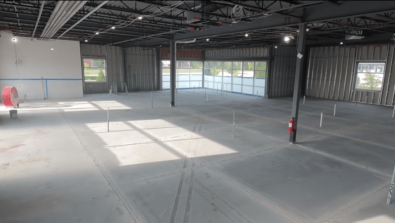 High-precision industrial concrete slab being finished