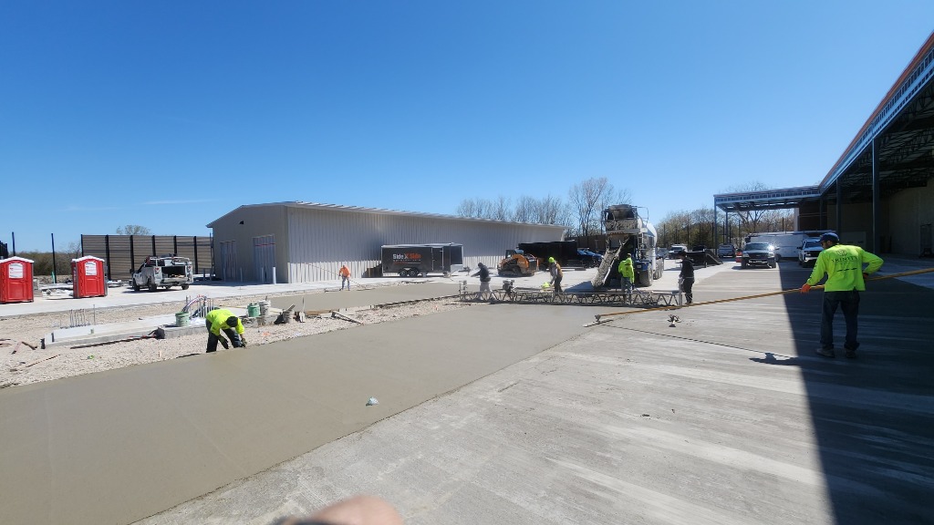 Trinity Construction crew pouring a commercial concrete driveway in Brookfield, Wisconsin