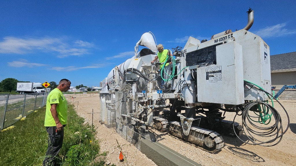 Commercial Curb and Gutter installation using Miller Formless slipform machine in SE Wisconsin